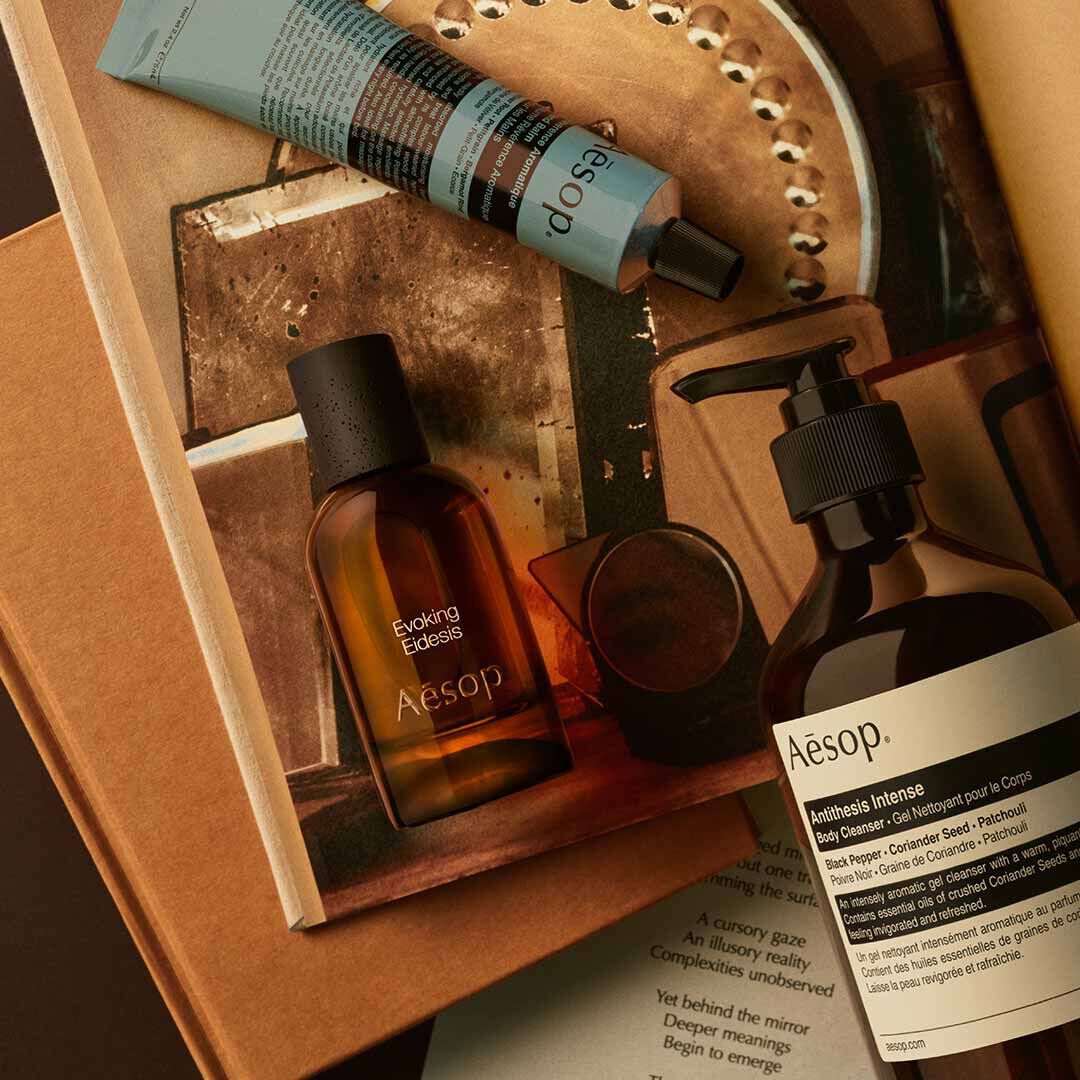 Aesop Evoking, Eidesis fragrance bottle, large pump bottle and cream tube in a box with printed materials.